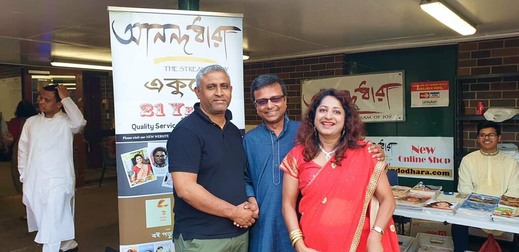 Three Anandodhara members at the '21 Years of Quality Service' stall